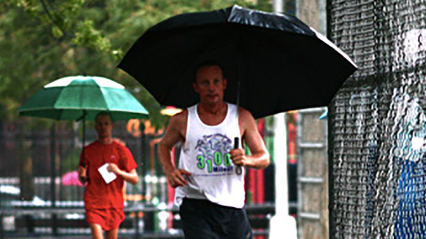 "It's a really good metaphor for life": Australian Grahak Cunningham running in the rain at the 3100 Mile Race. 
