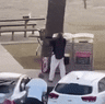 A bystander tackles an alleged gunmen at the Bondi Beach shooting.