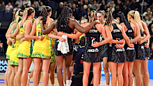 Australia and New Zealand huddle following game four in the Constellation Cup series.