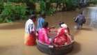 Akash Kunjumon and A. Aishwarya sail to their wedding in a giant cooking pot in Kerala, India. 