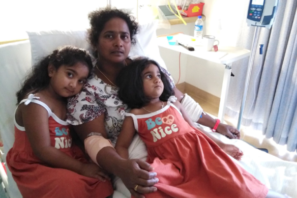 Asylum seeker Priya in hospital on Christmas Island with Kopika, 5, and Tharunicaa, 3, before being taken to Perth.