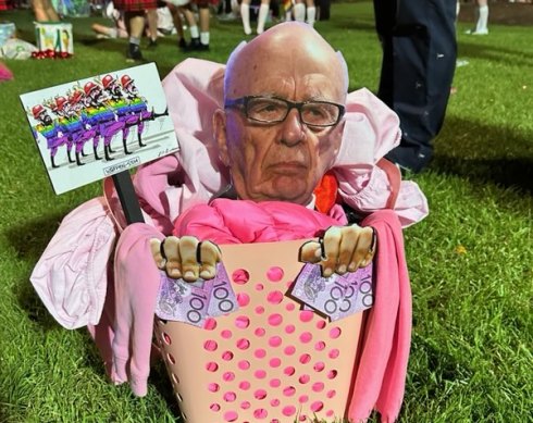 In the pink: A cut-out of Rupert Murdoch in a basket of “pink washing” at the 2023 Mardi Gras.