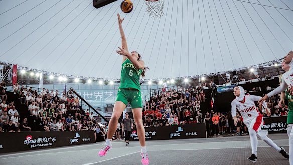 Australia's Carlie Smith lays up against Iran.