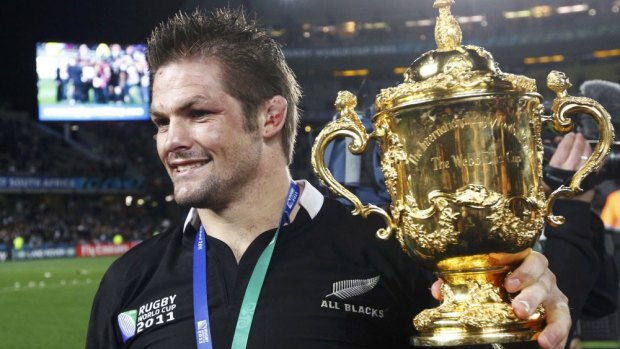 Richie McCaw holds the Webb Ellis Cup in Auckland after the All Blacks broke their long RWC drought on home soil.