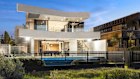 A gate at the home’s rear provides direct access to the beach. 