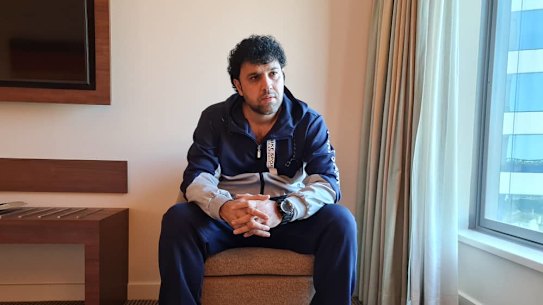 Afghan refugee Faridullah Mohibi is in hotel quarantine in Sydney after fleeing from Kabul with his wife and five children.