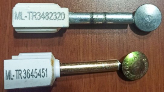 An allegedly fake container seal, top, and an official container seal, bottom.

