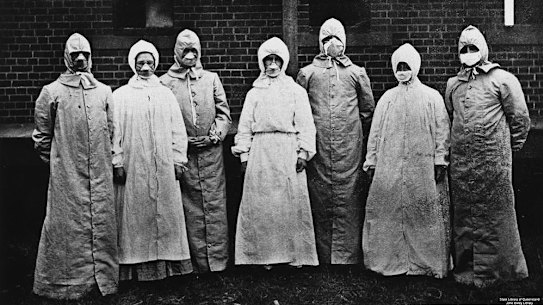 Dr Burnett Ham and his medical and nursing staff wore specially designed overalls and respirators when dealing with the sick.