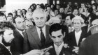 Gough Whitlam stands behind David Smith, the secretary to the Governor-General, as he reads the proclamation dissolving parliament following the dismissal of the Whitlam government.