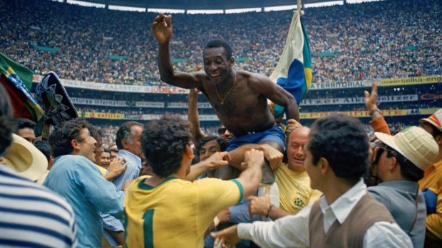 Elation: Brazil teammates hoist Pele high after winning the 1970 World Cup against Italy.