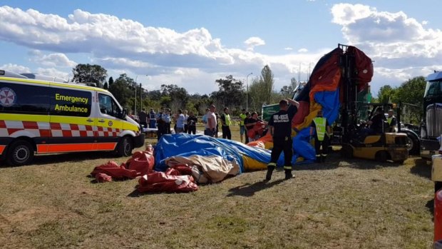 Four children have been injured after a jumping castle flipped in strong winds south-west of Sydney.