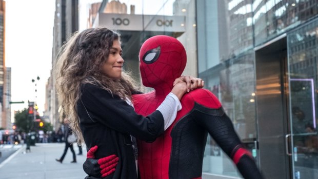 MJ (Zendaya) catches a ride from Spider-Man (Tom Holland) in Spider-Man: Far From Home. 