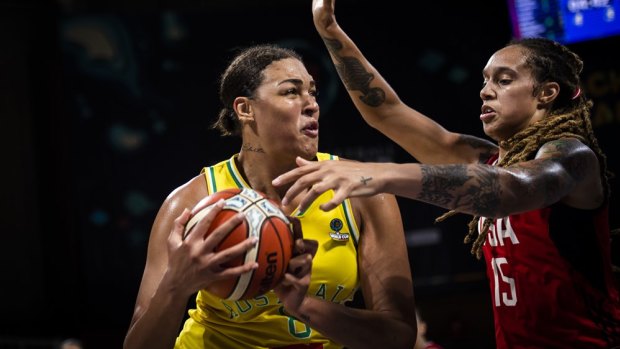 Tied up: Cambage (left) and Brittney Griner face-off in the gold medal match.