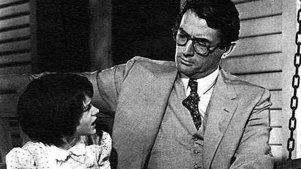  Gregory Peck  as Atticus Finch and and Mary Badham  as his daughter Scout in a scene from the 1962 Hollywood film, To Kill a Mockingbird.  