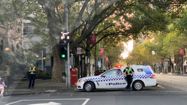 Police officers on Collins Street on Sunday morning.
