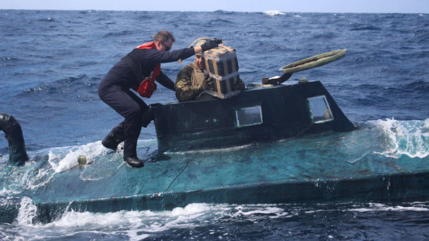 US Coast Guard members board a self-propelled semi-submersible in international waters in 2019. A new “narco sub” has been intercepted on its way to Puerto Rico.