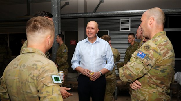 Peter Dutton met soldiers in Townsville last month.