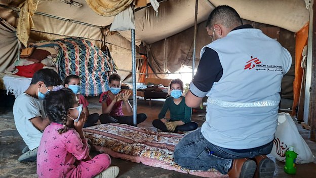 Doctors Without Borders educator Nader Owida conducts a COVID-19 health activity with children in Masafer Yatta, a collection of 19 Palestinian hamlets in the West Bank. 