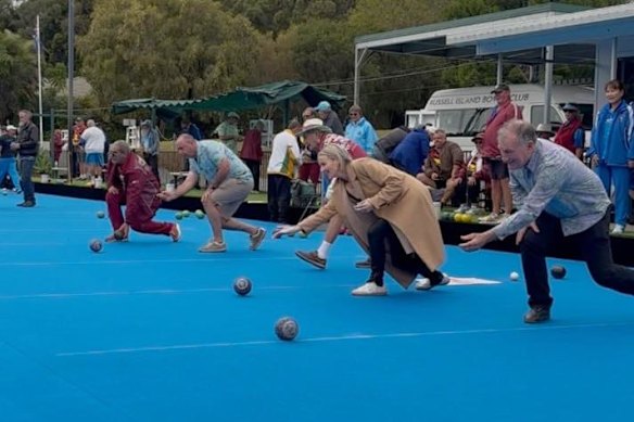 Shane Rendalls and Rebecca Young bowling on Russell Island.
