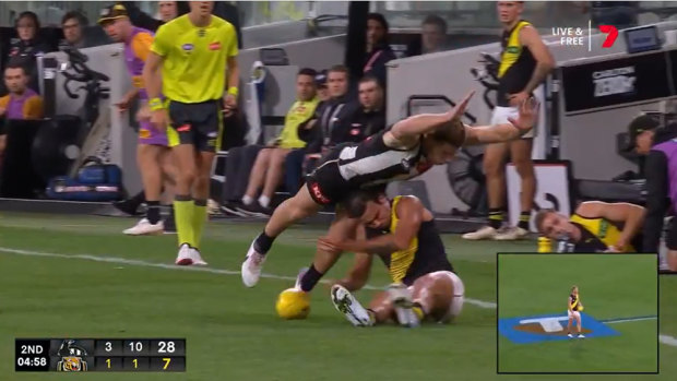 Taylor Adams swan dives over the top of Daniel Rioli. Source: Channel 7