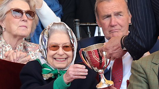 Queen Elizabeth II receives the winners cup at The Royal Windsor Horse Show at Home Park in Windsor, England. 