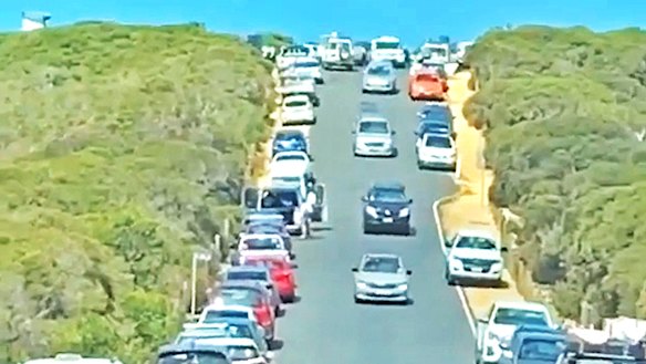 Cars line the street in Point Addis on the Great Ocean road on Saturday.