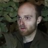 A still from an unverified video posted to YouTube in March that purportedly shows Oscar Jenkins being interviewed.