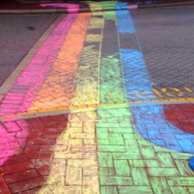 The Court Hotel chalked its sidewalks for Rainbow Riots.