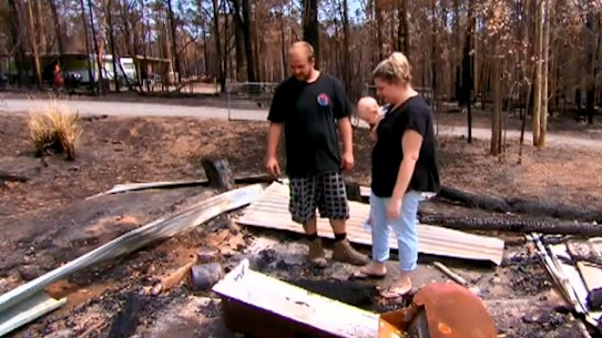 Mogo resident Melinda Evans, who was initially denied the payment, with her partner Paul and son Michael.