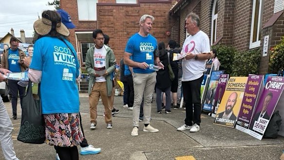 Gareth Hales, multimillionaire son of Plymouth Brethren Christian Church leader Bruce Hales, wears a blue Scott Yung campaign shirt at the Bennelong polling booth on April 30.