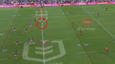 Valentine Holmes steps over the halfway mark while kicking off.