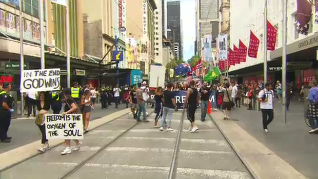 Protestors took issue with health restrictions and walked along Bourke Street Mall on Saturday. 