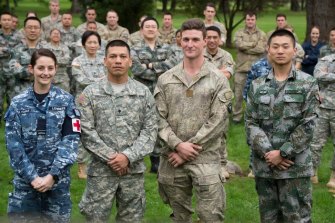 Welcome, China: defence personnel from Australia, the US, New Zealand and China who joined a multinational task group led by the NZ Defence Force and undertook community projects in Tonga in 2016. 