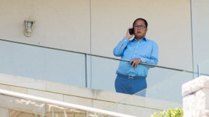 Chinese political donor Huang Xiangmo pictured on the balcony of his Mosman mansion last year.