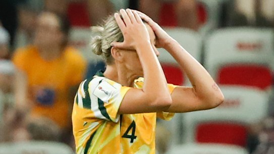 Australia's Alanna Kennedy leaves the pitch after receiving a red card.