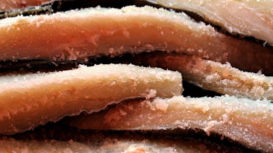 The boy's grandmother was cooking salted cod before he died.