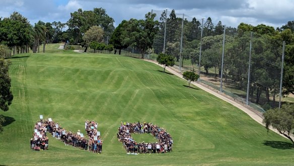 Protesters make a statement at Victoria Park on Saturday. 