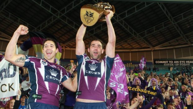 Cameron Smith and Billy Slater celebrate with their fans after winning the 2012 NRL Grand Final.