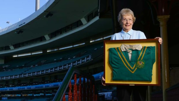 Joyce Churchill, poses with memorabilia of her late, great husband Clive at the SCG.