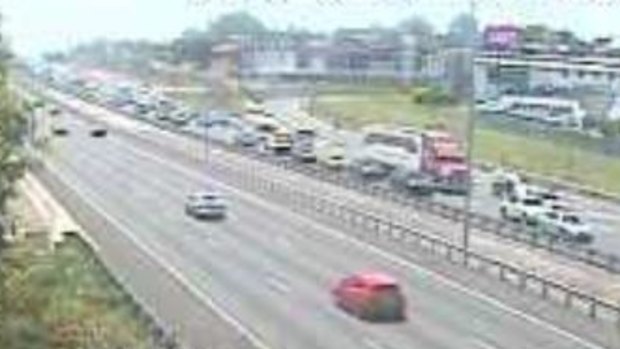 A north-facing traffic camera captured the chaos on the M1 through Slacks Creek just before 1pm on Saturday.