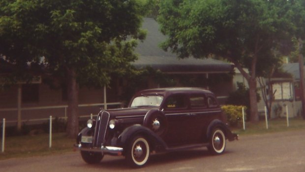 The same 1936 Plymouth parked in the same spot outside the Steampacket Hotel, 50 years later.
