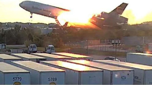 The fire in the area of the left pylon attachment to the wing continued as the plane cleared the blast fence.