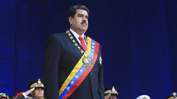 President Nicolas Maduro stands at attention during a event marking the 81st anniversary of the National Guard, in Caracas, Venezuela, on Saturday before the explosions.