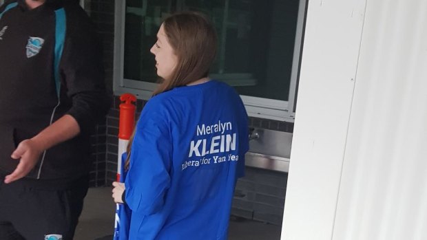 A volunteer a Liberal Party shirt bearing Meralyn Klein's name. The word 'Liberal' was later covered with masking tape.