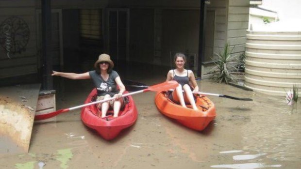 Friends Cesca Le Jeune and daughter Maeve canoe through our home in January 2011. Note the water tank on the right hand side of the photo.