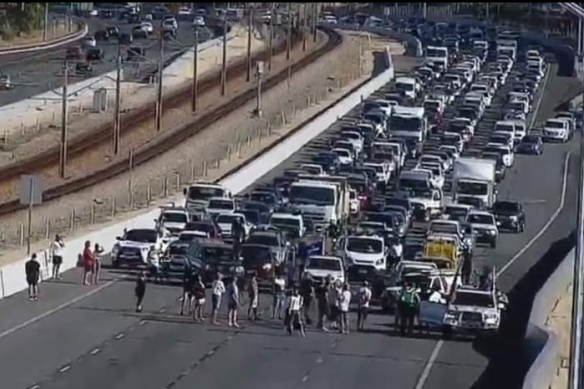 The small protest which brought Perth’s Mitchell Freeway to a standstill on Monday morning.