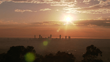 Smoke haze across Brisbane as fires burn west of the city.