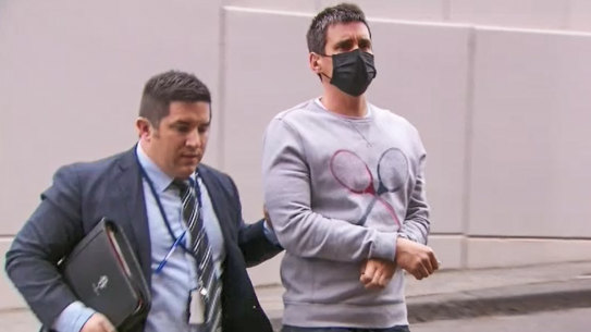 Richard Pusey (right) when arrested last year.