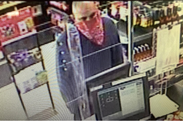 The man involved in the north Brisbane robberies is described as Caucasian in appearance, approximately 175cm tall with a bald head. He was wearing a red bandanna with white detail over his face, a grey jumper, dark shorts and white shoes.