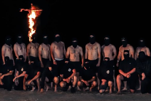 National Socialist Network members set fire to a cross during a visit to the Grampians National Park at the weekend.
